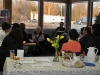 After dropping of their children, visitors\' parents enjoy refreshments during a meeting with Principal Allan Dueck and Rachel Swatzky